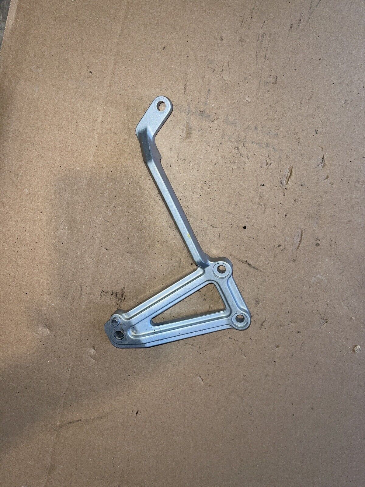 2007 Kawasaki Ninja EX250 F RIGHT REAR FOOT PEG BRACKET MOUNT OEM 