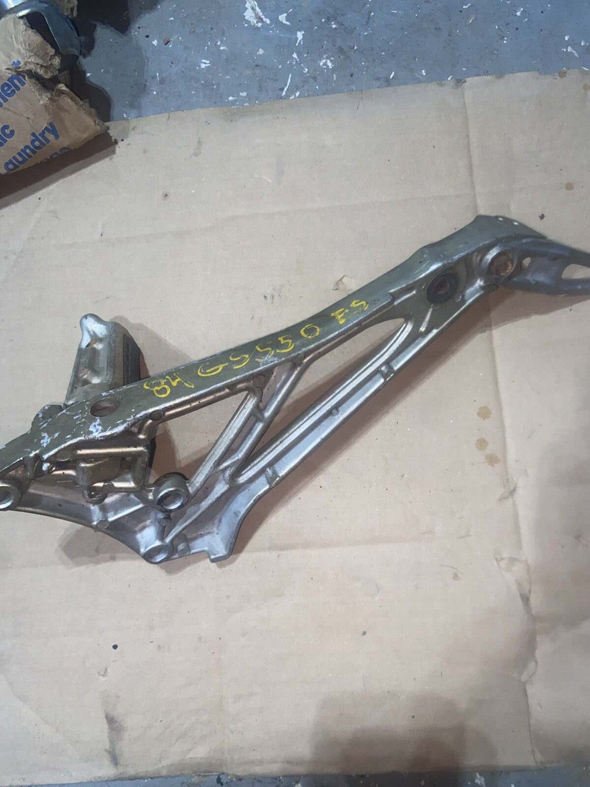 Suzuki GS550 OEM LEFT FOOT PEG REAR-SET BRACKET