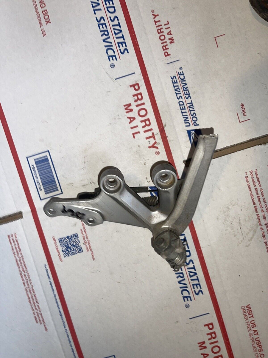 2004 Suzuki GSXR750 Right front foot peg bracket, brake pedal bracket