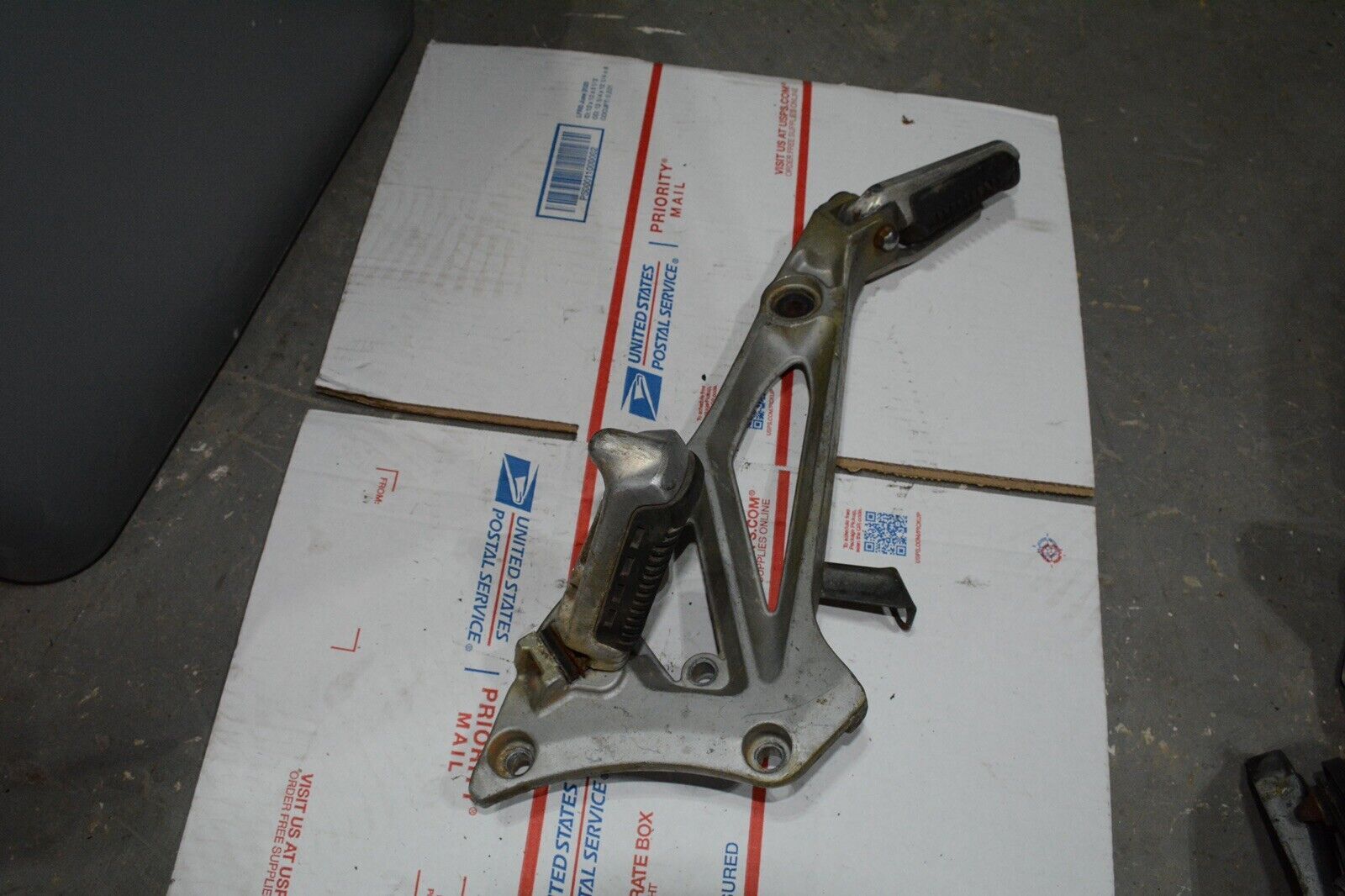 1983 Suzuki GS550E GS 550 E  Right side rear foot peg and mount bracket