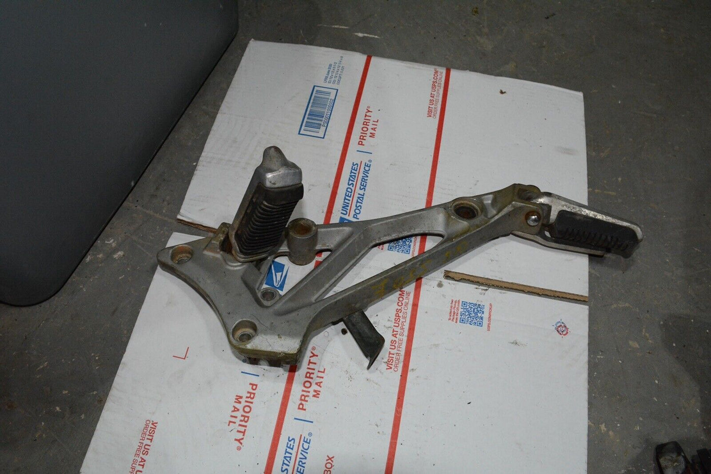 1983 Suzuki GS550E GS 550 E  Right side rear foot peg and mount bracket