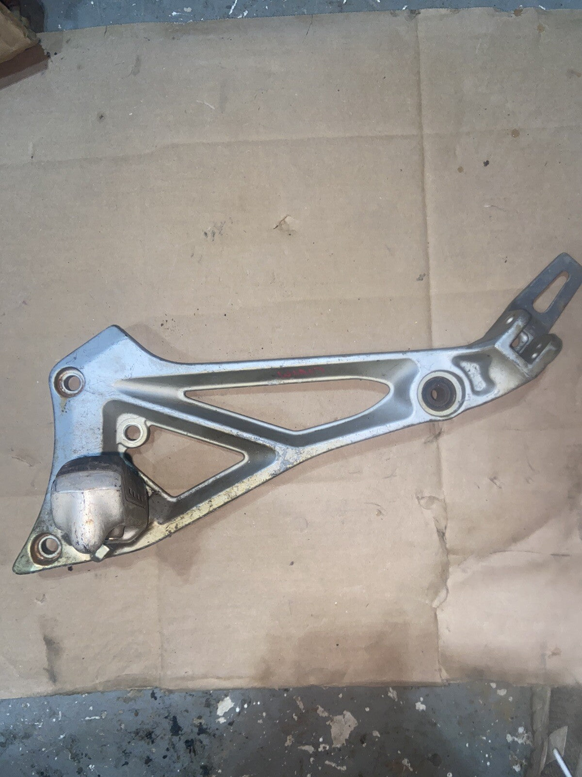 Suzuki GS550 OEM LEFT FOOT PEG REAR-SET BRACKET